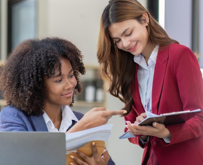 Teamwork of business people analysis graph Asian business woman advisor meeting to analyze and discuss on the financial report
